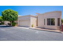 Charming single-story home featuring a private garage and well-maintained landscaping at 2647 N Miller Rd # 6, Scottsdale, AZ 85257