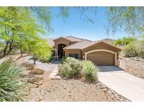 Stunning single-story home featuring a tile roof, low-maintenance landscaping, and an attached two-car garage at 33823 N 2Nd St, Phoenix, AZ 85085