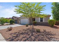 Charming single-story home featuring a well-kept yard and two-car garage at 37166 N El Morro Trl, San Tan Valley, AZ 85140