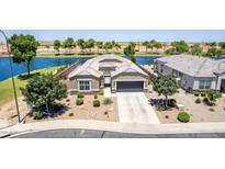 Stunning home featuring mature landscaping and waterfront views in a desirable neighborhood at 37456 W Vera Cruz Dr, Maricopa, AZ 85138