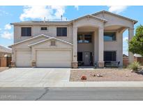 Charming two-story home featuring a two-car garage and welcoming front porch with decorative columns at 4118 N 304Th Ln, Buckeye, AZ 85396