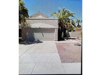 Charming single-Gathering home with a two-car garage and mature landscaping at 708 N Country Club Way, Chandler, AZ 85226