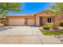 Charming single-story home featuring a three-car garage and desert landscaping at 7413 W Southgate Ave, Phoenix, AZ 85043