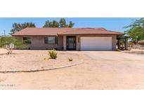 Charming single story home features a tile roof, two car garage, and brick accents at 7730 E Culver St, Mesa, AZ 85207