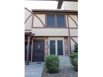 Charming townhome featuring a secure front entry and manicured landscaping at 7977 W Wacker Rd # 196, Peoria, AZ 85381