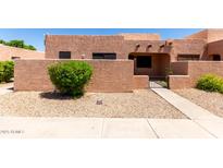 Charming single-story home with a stucco exterior, desert landscaping, and an inviting gated front entrance at 8940 W Olive Ave # 59, Peoria, AZ 85345