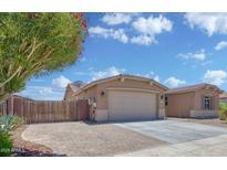 Charming single-story home with desert landscaping and a two-car garage, set against a beautiful blue sky at 1101 W Oleander Ave, Queen Creek, AZ 85140