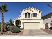 Charming two-story home with a well-manicured lawn and classic architectural details, a true curb appeal at 19943 N 77Th Ave, Glendale, AZ 85308