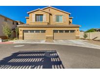 Inviting two-story home featuring a two-car garage, classic shutters, and charming curb appeal at 2254 E University Dr # 4, Mesa, AZ 85213