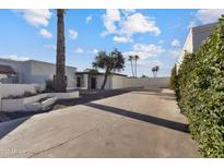 Charming single-story home with desert landscaping and a spacious driveway on a sunny day at 3218 W Clinton St, Phoenix, AZ 85029