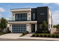 Striking modern two-story home featuring a sleek black and white color scheme, balcony, and an integrated garage at 4422 E Roma Ave, Phoenix, AZ 85018