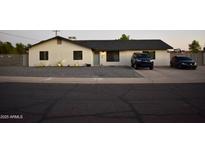 Charming single-story home featuring a well-kept yard and a lovely desert landscape at 4755 E Gary St, Mesa, AZ 85205