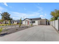Inviting single-story home featuring a neutral color palette, low maintenance yard, and a concrete driveway at 2402 N 15Th St, Phoenix, AZ 85006