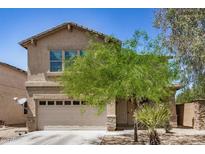 Charming two-story home featuring a two-car garage and desert landscaping in a sunny setting at 3228 W Saint Anne Ave, Phoenix, AZ 85041