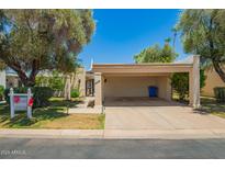 Charming single-story home with covered carport, mature trees, and well-maintained landscaping in a desirable location at 6035 N 9Th Ave, Phoenix, AZ 85013