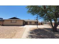 Charming single-story brick home with a basketball hoop, mature landscaping, and a spacious driveway at 1103 E Palmcroft Dr, Tempe, AZ 85282