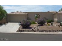 A single story home featuring a stucco exterior, a two car garage, and desert landscaping in the front yard at 14214 N Galatea Dr # A, Fountain Hills, AZ 85268