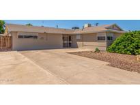 Charming single-story home featuring a long driveway and neutral-toned exterior at 4553 N 54Th Ave, Phoenix, AZ 85031