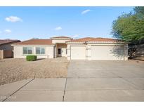Charming single-story home with a terra cotta roof, low-maintenance yard, and an attached two-car garage at 6805 S 14Th St, Phoenix, AZ 85042