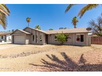Charming single-story home with desert landscaping and attached two-car garage at 10115 W Turney Ave, Phoenix, AZ 85037