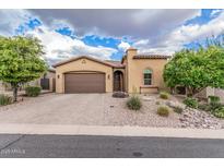 Charming single-story home with a two-car garage and desert landscaping at 10713 N 124Th Pl, Scottsdale, AZ 85259