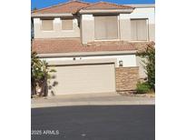 Inviting two-story home with a two-car garage and a well-maintained yard with desert landscaping at 1257 E Voltaire Ave, Phoenix, AZ 85022