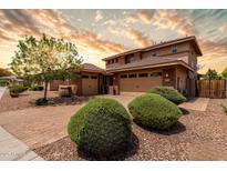 Stunning two-story home with a three-car garage and professionally landscaped front yard at 3338 E Coconino Dr, Gilbert, AZ 85298