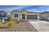 Charming single-story home with desert landscaping and a two-car attached garage at 5267 E Diatomite Dr, San Tan Valley, AZ 85143