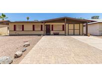 Charming single-story home featuring a low-pitched roof and a quaint brick driveway for curb appeal at 18217 N 34Th Ave, Phoenix, AZ 85053