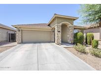 Charming single-story home featuring a two-car garage and stone-accented entryway at 2717 W Bowker St, Phoenix, AZ 85041