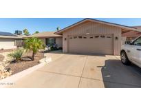 Charming single-story home with a two-car garage, desert landscaping and inviting curb appeal at 3529 W Saint Moritz Ln, Phoenix, AZ 85053