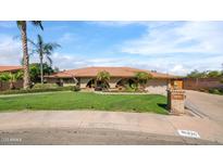 Beautiful single-story home with a well-manicured lawn and mature trees, creating a warm and inviting curb appeal at 426 E Carol Ann Way, Phoenix, AZ 85022