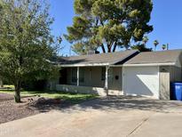 Beautiful home with lush landscaping, mature trees, and a welcoming facade at 4539 N 18Th Ave, Phoenix, AZ 85015