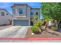 Beautiful two-story home with a gray stucco exterior, landscaped yard, and a two-car garage at 9918 E Escondido Ave, Mesa, AZ 85208