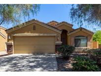 Inviting single-story home with a well-manicured front yard and attached two-car garage in a suburban neighborhood at 23682 W Bowker St, Buckeye, AZ 85326