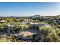 Expansive aerial view of custom home with desert landscaping, mountains, and blue skies at 39089 N 102Nd Way, Scottsdale, AZ 85262