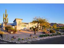 Modern home featuring desert landscaping with cacti and drought-tolerant plants at 6529 N Mountain View Dr, Paradise Valley, AZ 85253