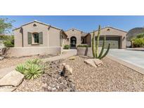 Charming single-story home featuring desert landscaping and a secure gated entrance at 12710 W Forest Pleasant Pl, Peoria, AZ 85383