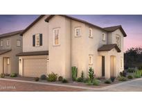 Charming two-story home with a two-car garage, desert landscaping, and a warm, inviting facade at 16456 W Whispering Wind Dr, Surprise, AZ 85387