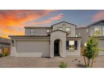 Charming two-story home with an attached two-car garage and desert landscaping against a vibrant sky at 3944 E Ghost Flower Ln, San Tan Valley, AZ 85140