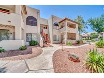Inviting condo building with well-maintained landscaping and walkways on a bright sunny day at 750 E Northern Ave # 2006, Phoenix, AZ 85020