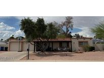 Charming single-story home with covered patio and a well-maintained desert landscape at 1046 E Fairfield St, Mesa, AZ 85203