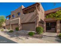 Beautiful townhouse exterior featuring garages, landscaped grounds and lovely architectural detail at 13600 N Fountain Hills Blvd # 501, Fountain Hills, AZ 85268