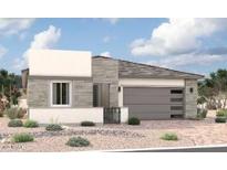 Modern single-story home featuring a two-car garage, stone veneer accents, and desert landscaping at 15872 W Miami St, Goodyear, AZ 85338