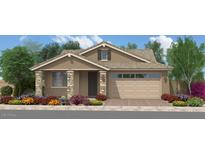 Charming single-story home with stone accents, a two-car garage, and beautifully landscaped front yard at 18747 W Monterosa St, Litchfield Park, AZ 85340