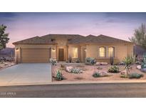 Inviting single-story home featuring a neutral color palette, tile roof and low maintenance desert landscaping at 18858 N 269Th Ln, Buckeye, AZ 85396