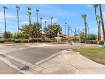Community entrance with roundabout and fountain at 19400 N Westbrook Pkwy # 220, Peoria, AZ 85382