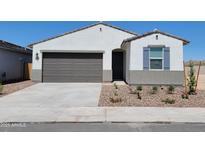 Charming single-story home featuring a two-car garage, low maintenance landscaping, and a welcoming entryway at 3550 N Camden Dr, Florence, AZ 85132