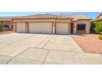 Charming home featuring a three-car garage and desert landscaping for low maintenance and curb appeal at 639 E Palo Verde St, Casa Grande, AZ 85122