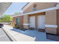 Condo featuring dual front doors, unit identifiers, and desert landscaping offering appealing curb appeal at 854 S San Marcos Bldg 6 -- # A, Apache Junction, AZ 85120